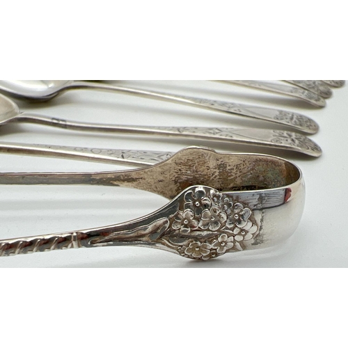 1118 - A small pair of decorative sterling silver sugar nips with floral decoration. Together with a set of... 