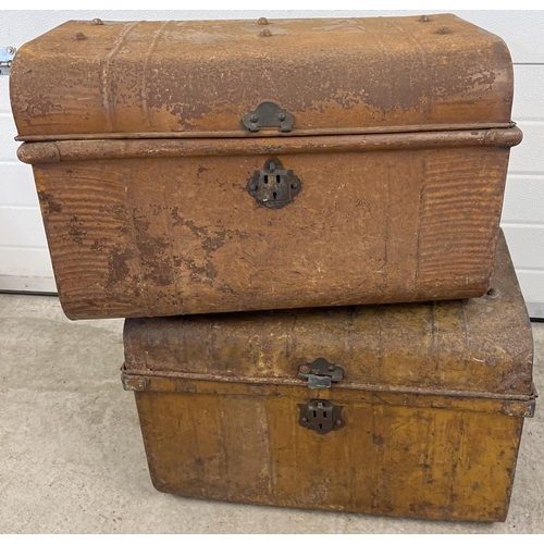 1152 - 2 vintage tin trunks. Both with carry handles and stud detail to top. Front catch to both a/f. Large... 