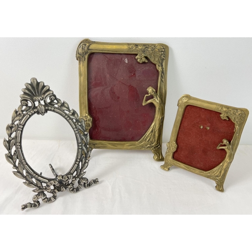 1154 - 2 brass Art Nouveau style picture frames with figure and floral detail. Together with an oval metal ... 