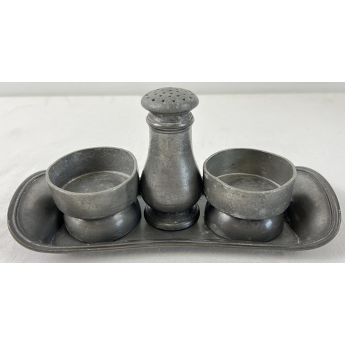 1158 - An early 20th century James Dixon & Sons pewter 4 piece cruet. Stamped to underside of tray and pepp... 