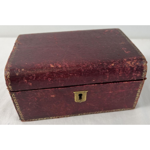 1083 - An antique red leather covered jewellery box with lift out compartment tray & contents. Gilt decorat... 