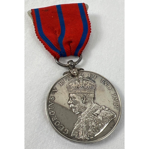 1188 - A George V Metropolitan Police Coronation 1911 medal, named to P.C.  G Greenfield. On red and blue s... 