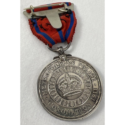 1188 - A George V Metropolitan Police Coronation 1911 medal, named to P.C.  G Greenfield. On red and blue s... 