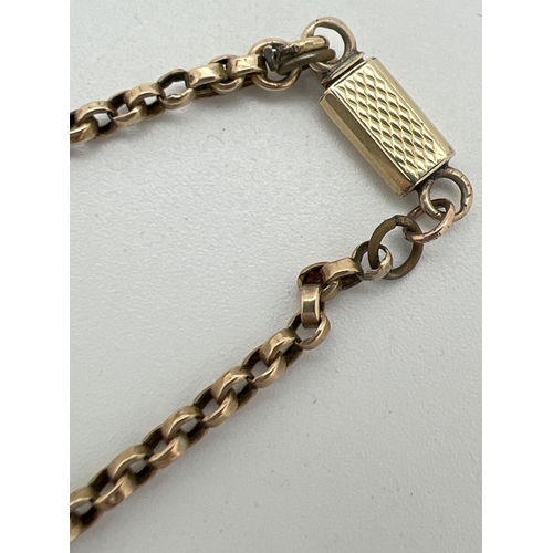 1084 - A 9ct gold belcher chain with engine turned push clasp, for scrap or repair. Total weight approx. 5.... 