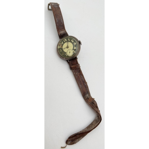 1193 - A WWI silver cased military wrist watch with leather strap, subsidiary seconds dial and enamelled fa... 