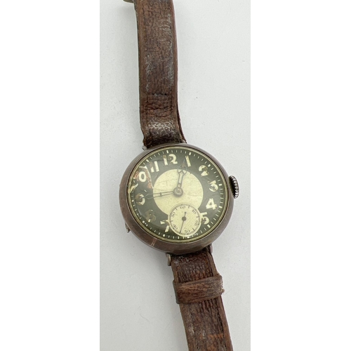 1193 - A WWI silver cased military wrist watch with leather strap, subsidiary seconds dial and enamelled fa... 