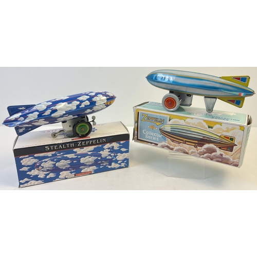 1366 - 2 boxed Schylling tinplate wind-up collectors toys in the shape of zeppelin's. A Graf Zeppelin in pa... 