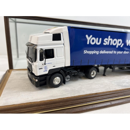 1369 - A 1:43 scale diecast Tibbett & Britten Tesco lorry by Eligor in a bespoke made glass display case. C... 