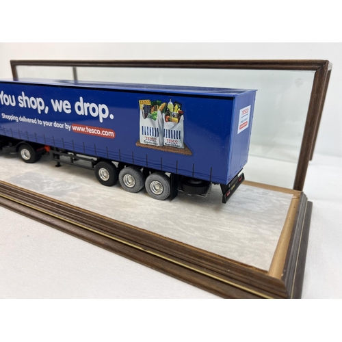 1369 - A 1:43 scale diecast Tibbett & Britten Tesco lorry by Eligor in a bespoke made glass display case. C... 