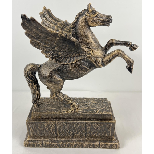 1207 - A large bronzed effect cast iron figurine of a rearing flying horse on a rectangular shaped base. Ap... 