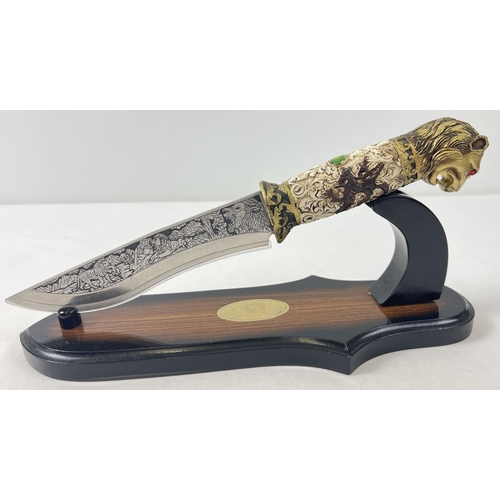 1230 - An ornamental knife with resin lions head detail to handle. Scroll and floral detail to handle and e... 