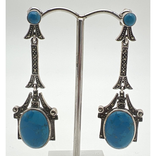 1003 - A pair of modern Art Nouveau style silver drop earrings, set with turquoise cabochons & marcasite st... 