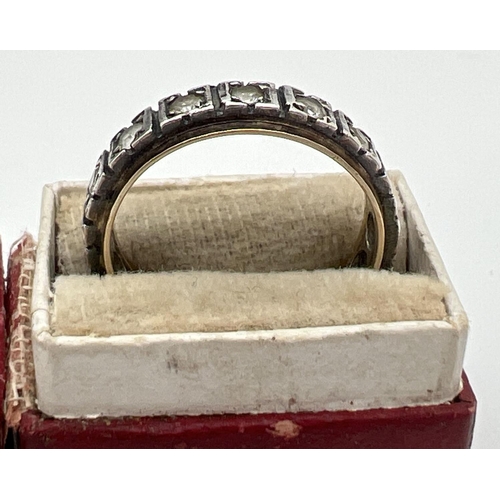 1011 - A vintage silver and 9ct gold white topaz set full eternity ring, in a vintage ring box. Inside of b... 