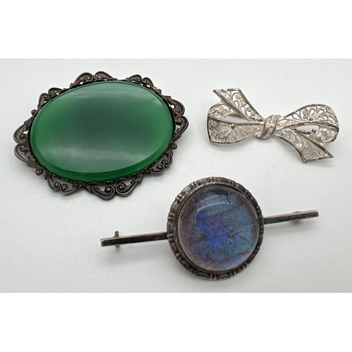 1016 - 2 silver brooches together with a vintage white metal butterfly wing brooch (pin missing). Silver br... 