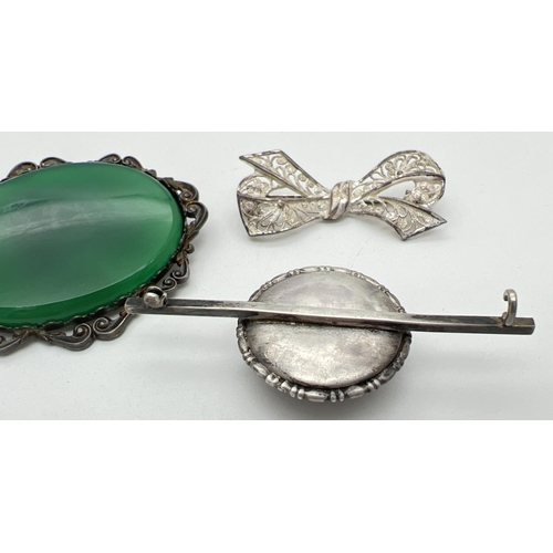 1016 - 2 silver brooches together with a vintage white metal butterfly wing brooch (pin missing). Silver br... 