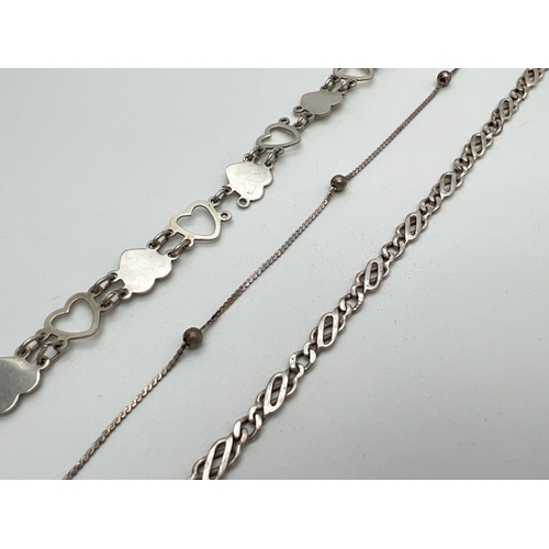 1028 - 3 vintage silver bracelets. A heart shaped link; a ball and chain; and a Figaro style chain bracelet... 