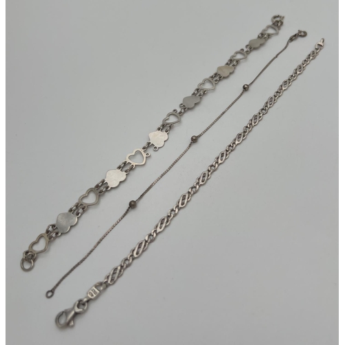 1028 - 3 vintage silver bracelets. A heart shaped link; a ball and chain; and a Figaro style chain bracelet... 