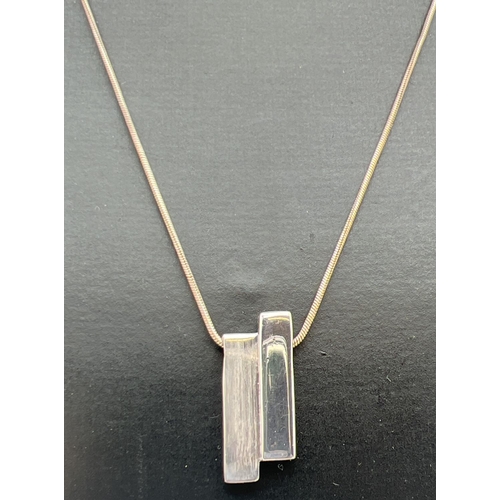 1034 - A modern design silver pendant necklace in brushed and plain silver, by Liga. Silver and makers mark... 