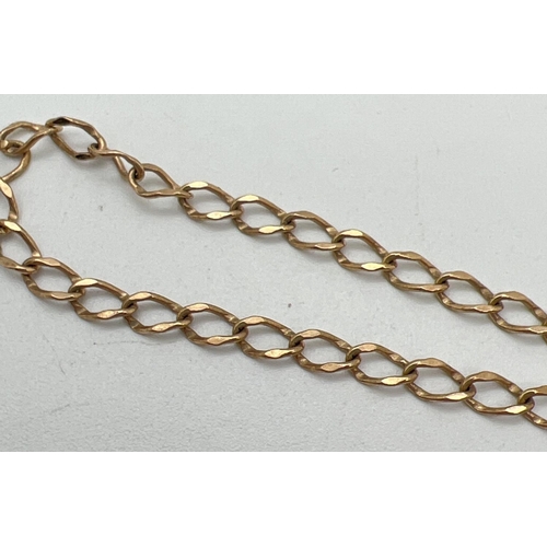 1035 - A 9ct gold curb chain bracelet with padlock clasp and safety chain. Hallmarks to back of padlock. Ap... 