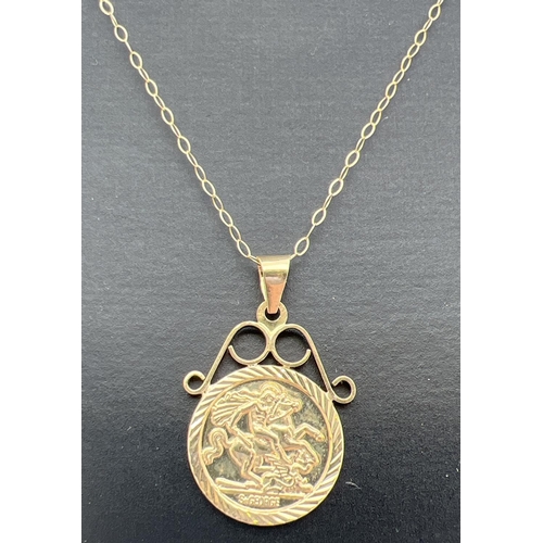 1050 - A 9ct gold St. George medallion pendant in scroll design mount, on an 18