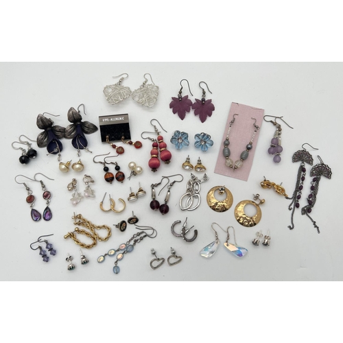 1051 - 30 pairs of costume jewellery earrings in various designs, in both stud and drop styles. To include ... 