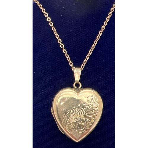 1059 - A vintage 9ct gold front and back heart shaped locket with half floral engraving to front. On a 17 i... 