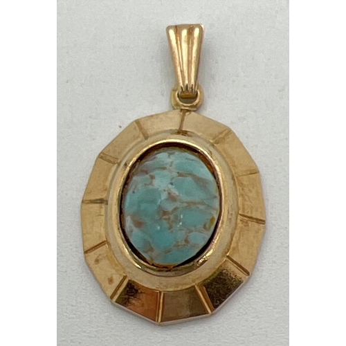 1066 - A vintage 9ct gold oval shaped pendant set with a turquoise cabochon. Gold marks to back of pendant.... 