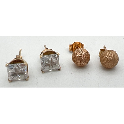 1073 - 2 pairs of gold stud style earrings. A pair of brushed gold ball studs together with a pair of studs... 