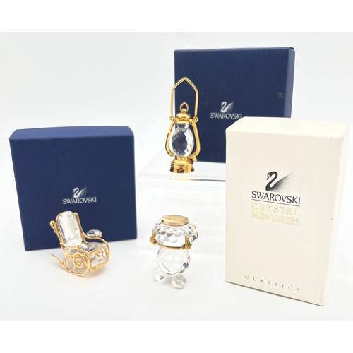 1289 - 3 boxed small Swarovski crystal and gold tone metal collectibles. Comprising a Tilley lamp, rocking ... 