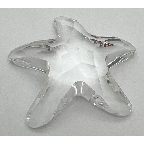 1290 - A Swarovski crystal starfish, complete with box. Swan mark to back. Approx. 5.5 x 6cm.