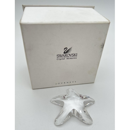 1290 - A Swarovski crystal starfish, complete with box. Swan mark to back. Approx. 5.5 x 6cm.