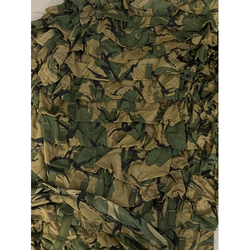 1235 - A 3 piece military woodland camouflage Ghillie suit. Comprising helmet and head cover, jacket/top an... 