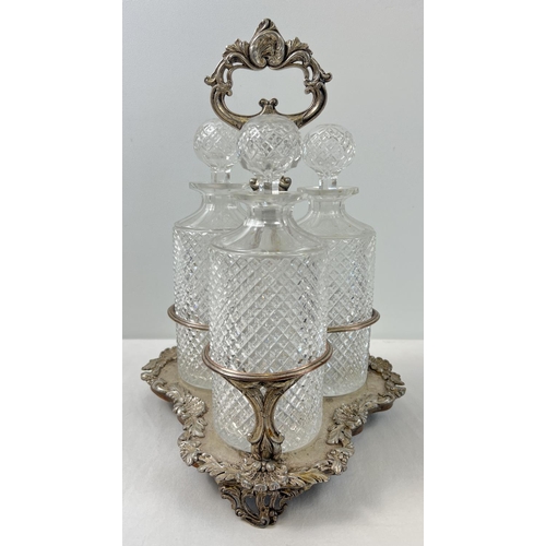 1151 - A vintage silver plated triple decanter stand complete with 3 cut glass decanters with cut diamond p... 