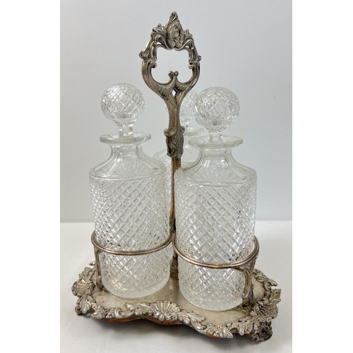 1151 - A vintage silver plated triple decanter stand complete with 3 cut glass decanters with cut diamond p... 