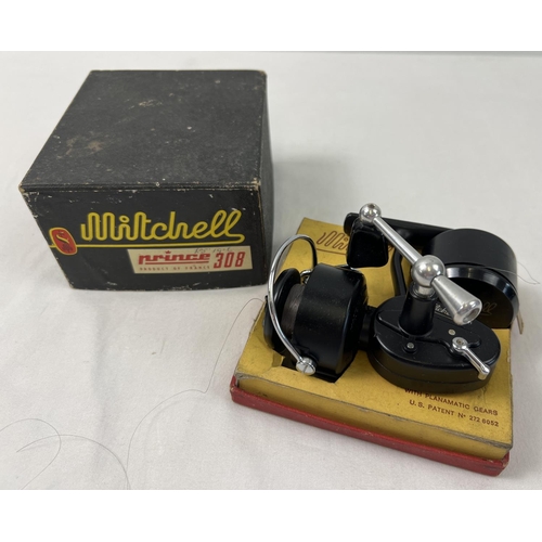 1395 - A boxed vintage Mitchell Prince 308 fishing reel with planamatic gears. Complete with extra spool an... 