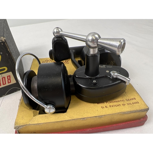 1395 - A boxed vintage Mitchell Prince 308 fishing reel with planamatic gears. Complete with extra spool an... 