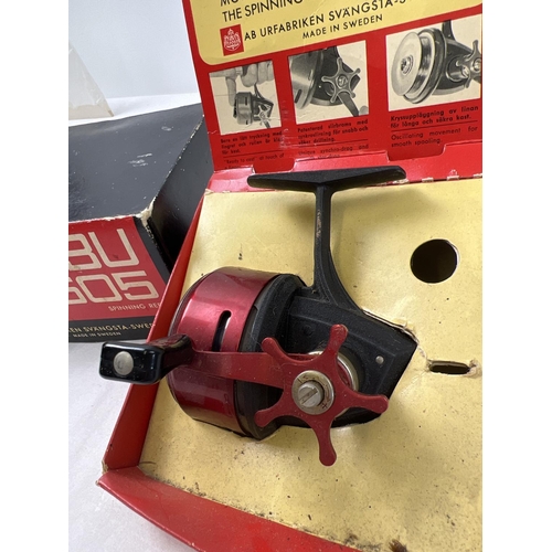 1396 - A boxed vintage Swedish ABU-505 closed face fishing reel in red chrome and black finish. Donated to ... 