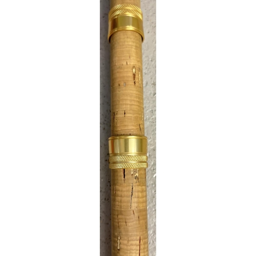 1397 - A vintage 13ft long Match Farstrike glass fishing rod with cork handle. Gold tone alloy rings to han... 