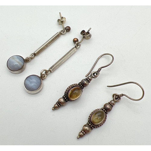 1095 - 2 pairs of silver drop earrings. An ethnic style pair set with round citrine cabochons and a pair se... 