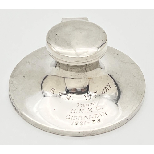 1153 - An Art Deco silver inkwell with filled base and inscription to front 