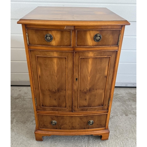 1494 - A Bevan Funnel 'Reprodux' yew wood veneer bow fronted cabinet with brass ring handles. 2 door cupboa... 