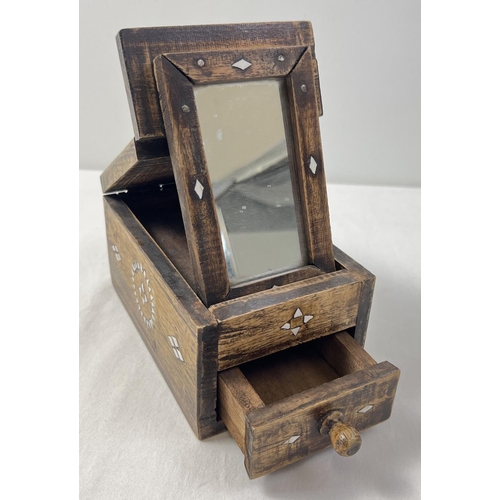 1410 - A vintage ethnic hardwood vanity box with inlaid mother of pearl detail to each side. Lift up foldin... 