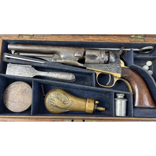 1210 - An antique 1851 U.S.A. .36 Navy Colt pistol with original box and accessories. Wooden grips with bra... 