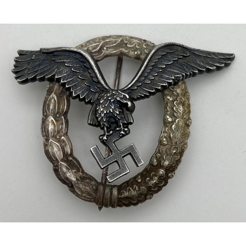 1212 - A WWII style German Luftwaffe Pilots badge with eagle and wreath detail. Marked B S W to back. Appro... 