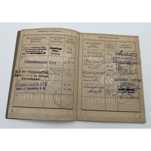 1215 - A World War II style Employment record documentation book with stamped and hand written information ... 