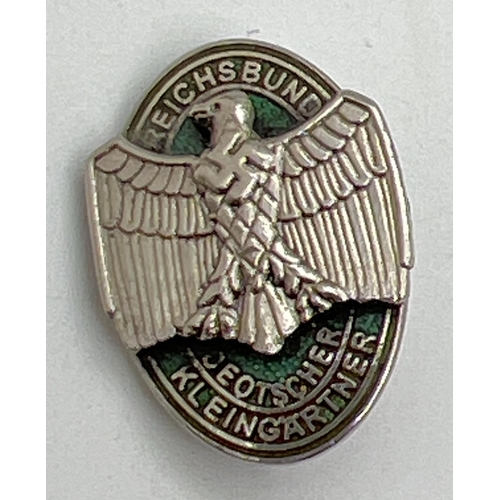 1216 - A World War II style German State For Gardeners pin badge depicting an eagle on an oval backgound. A... 