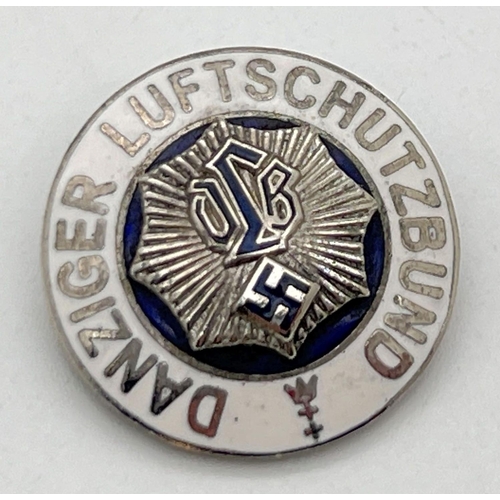 1220 - A World War II style Danziger Luftschutzbund circular pin badge with white enamel detail. Approx. 2.... 