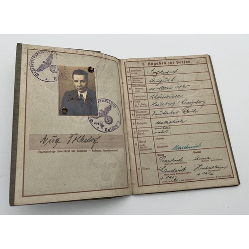 1222 - A World War II Wehrpass conscript registration book Auiguist Folksdorf with identity photo. Stamped ... 