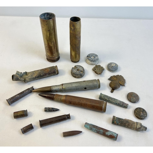 1223 - A collection of military metal detector finds. To include cap badges, shell cases and buttons. This ... 