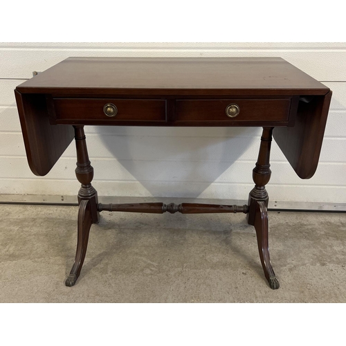 1496 - A modern dark wood, 2 drawer hall/console table with drop leaf ends. Brass claw feet & loop handles ... 